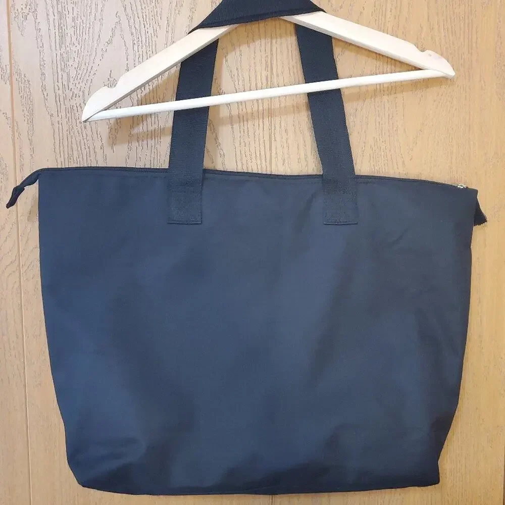 Disney's The Lion King with a Spacious Black Broadway Musical Zip Tote Bag!